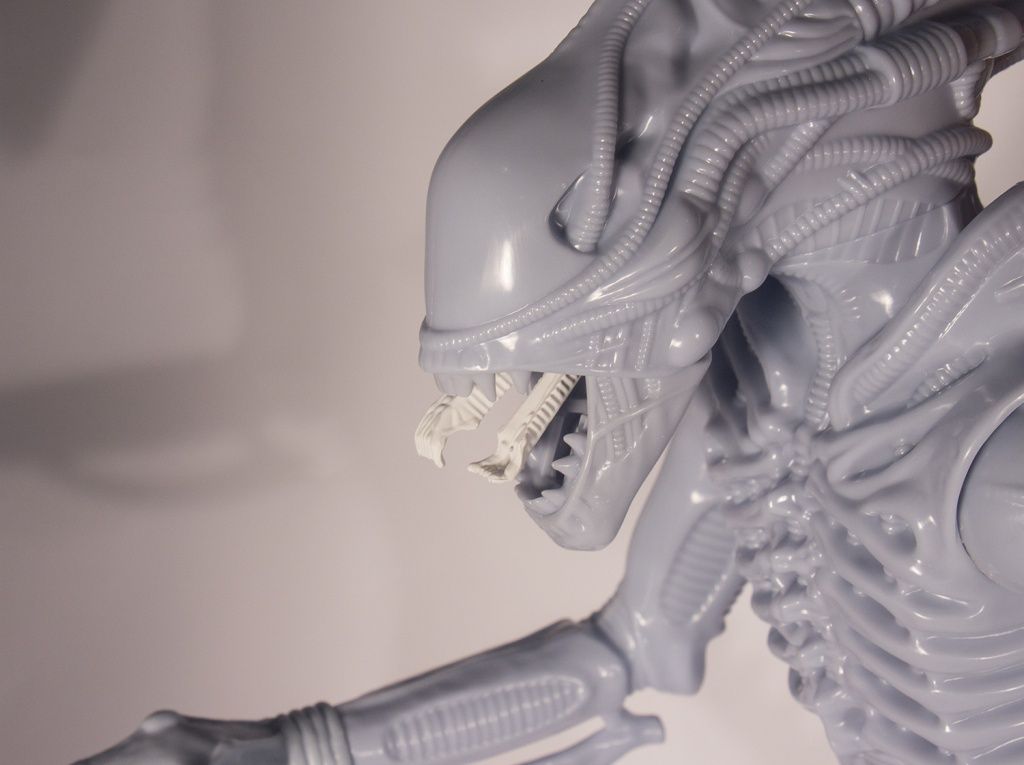 The Alien Warrior measures 18-inches and matches the features of the original 1979 Kenner Alien. It is articulated at the hips, shoulders, wrists, and tail, and has the same spring-loaded jaw mechanism to release the horrifying inner jaws, operated with a trigger on the back of the head. The figure can also hang from its tail just like the original.